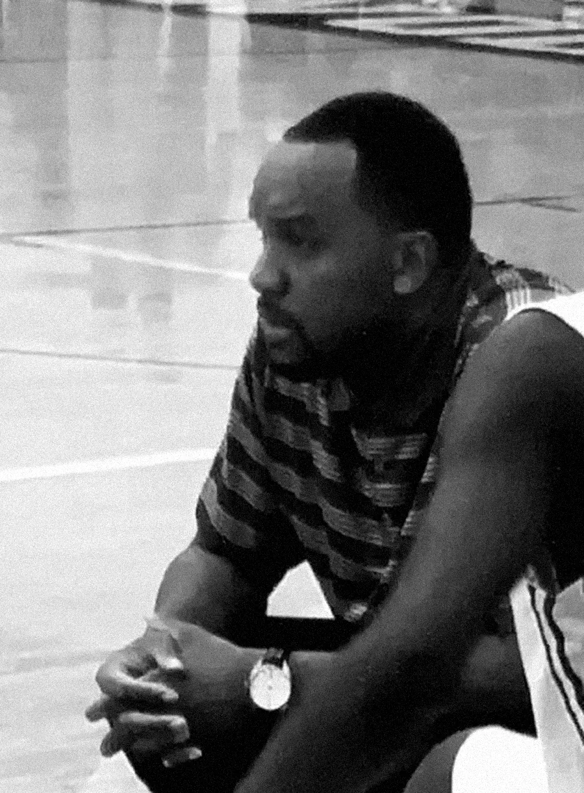 Coach Hansbro on the bench during a game